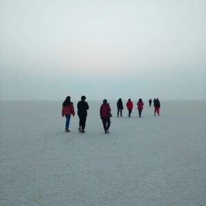 F5 Escapes women's group walking across the vast white salt desert of the Little Rann of Kutch.