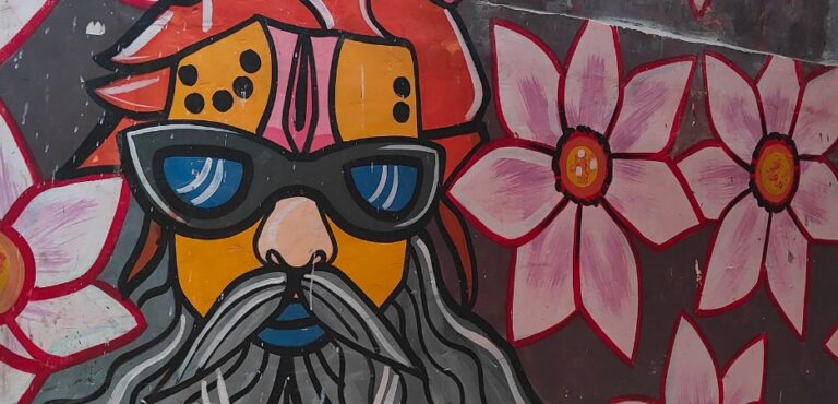 Vibrant and colorful street art painted on the walls of Varanasi's narrow alleys.
