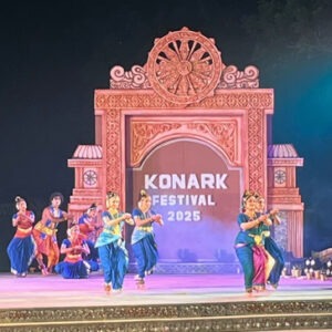 Odisha women group tour with F5 Escapes - Classical dancers performing on stage at the 2025 Konark Dance Festival in Odisha.