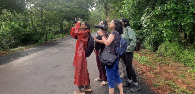 Women enjoying bird watching in a group tour