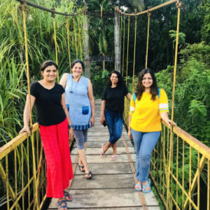 Western Ghats women group tour - Women on suspension bridge in Karnataka
